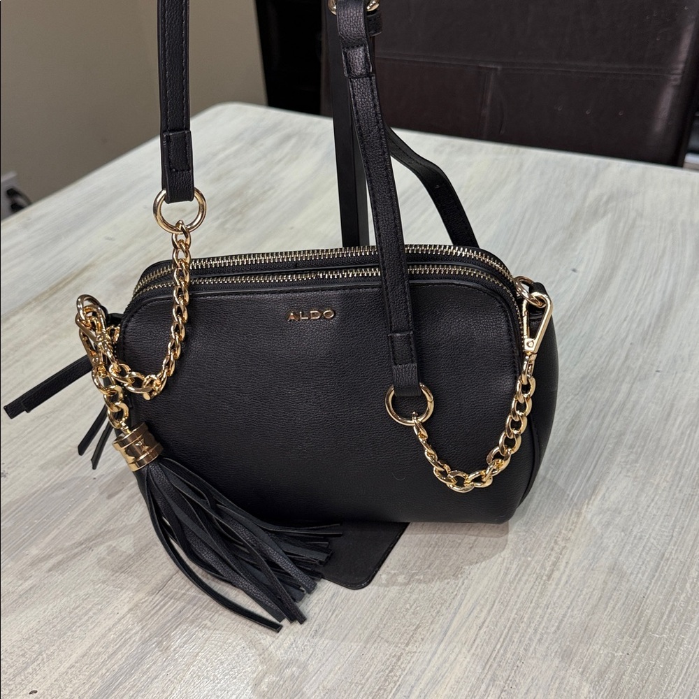 Aldo Black Crossbody Bag with Gold Chain and Tassel